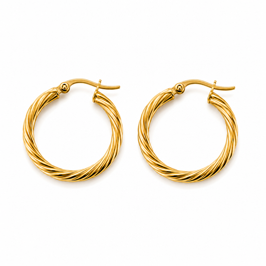 Pair of gold twisted hoop earrings on white background